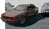BMW E34 mit schwarzen Hella Elipsoid Scheinwerfer